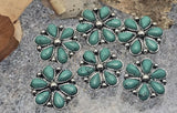 Create standout hatbands and bracelets with these 2-hole western flower slider beads. Each concho-inspired slider has teardrop turquoise-tone petals and dotted silver edges. Two parallel holes accommodate leather lace, seed bead strips, or paracord, keeping the flower centered and secure. A top pick for Southwestern jewelry making, bolo tie accents, and adjustable bracelets.