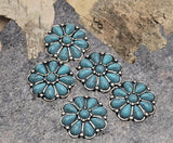 Add Southwestern charm with these turquoise flower two‑hole sliders. The concho‑inspired metal beads feature marbled petals and beaded silver edging. Perfect focal beads for bracelets, pendants, hatbands, and boot straps. Parallel holes stabilize leather, paracord, or seed‑bead strips. Essential jewelry findings and spacer beads for western bracelets, ranch‑style necklaces, and festival accessories.