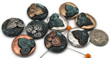 Beautifully detailed 2‑hole metal slider beads in antique copper, silver, gold, and patina finishes—perfect statement focal beads for your handmade bracelets or necklaces. Their floral relief designs sit atop a domed, rustic metal base that brings dimension and depth to any jewelry piece. Use these focal spacer beads to connect leather cords, beading wire, or paracord for unique boho or artisan‑style jewelry with a touch of vintage beauty.