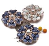These bright gold metal 2 hole slide/spacer beads feature a layered flower motif with blue and light-blue enamel and a faux pearl center. The double-hole design and rear guide loops help keep materials straight, ideal for bracelets, bead weaving, and wire-wrapped pendants. Use as focal sliders or connectors and accent with seed beads for contrast. Eye-catching, lead and nickel compliant beading components for earrings, necklaces, and rings.