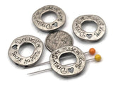 Light antique silver 2 hole slider beads with “Dreams are made of love” and a heart cutout make meaningful focals for jewelry making and crafting. Use these metal beads as sliders, spacers, or connector components in bracelet stacks, pendant necklaces, and earrings. Pair with seed beads, gemstone chips, crystals, pearls, Czech glass, or other metallic beads as fillers to complete the look. Unique floral‑free round style beading findings and supplies; great for boutique or small wholesale.