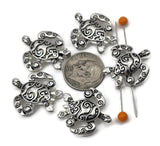 Bright silver turtle 2 hole slider beads for jewelry making, beading, and crafting. These metal beads create an easy ocean focal, spacer, or connector in a bracelet, pendant necklace, or earrings. Pair the sea turtle slider with seed beads as filler beads, beach gemstones (howlite, jasper, amazonite), pearls, crystals, or other metallic beads to finish coastal designs. Fun beading components and findings for summer stacks, gifts, beach weddings, and small‑batch wholesale.