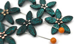 Create coordinated sets quickly with antiqued teal flower sliders. Center one on a bracelet, repeat as a pendant connector on a necklace, and finish with simple earrings. Combine with seed beads for delicate spacing, then highlight with crystal accents or pearls. These two hole slider beads function as spacers, connectors, and focal components—must‑have metal beads, findings, and beading components for jewelry making and crafting.