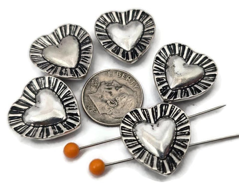 Silver heart 2 hole slider beads with a dimensional center and textured sunburst border. Use these metal beads as focal sliders, spacers, or connector components in bracelet stacks, chokers, and necklaces. Frame with seed beads as filler beads, then add crystals, pearls, or Czech glass for shimmer. Romantic beading components and findings for gifts, bridesmaid sets, friendship jewelry, and small‑batch wholesale. Lead and nickel compliant jewelry making supplies.