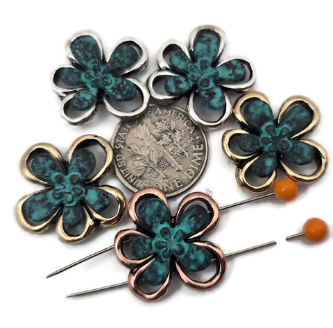 Mixed‑metal flower 2 hole slider beads with a turquoise patina center and open petal outline in antique silver, gold, and copper. Use as focal sliders, spacers, or connector components for bracelets, chokers, necklaces, and earrings. Frame with seed beads as filler beads; add Czech glass, pearls, or crystals for shimmer. Essential metal beads and jewelry findings for boho, tropical, and spring collections. Lead and nickel compliant supplies for DIY makers and small‑batch wholesale.