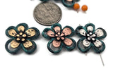 Artisan floral 2 hole slider beads featuring teal patina outlines and hammered‑look petals in mixed metals. Ideal for bracelets, anklets, chokers, and necklaces. Use seed beads as filler beads, heishi spacers for texture, and Czech glass or crystal accents for sparkle. Lead and nickel compliant metal beads and jewelry making supplies for boho‑floral themes and spring markets.