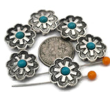 These Southwestern cross‑flower 2 hole slider beads feature a turquoise‑style center set in a bold silver‑tone floral design. The double‑hole construction keeps two strands aligned, making them ideal focal beads for leather bracelets, chokers, and hatbands. Pair with seed beads, Czech beads, heishi, or gemstone chips for classic Western jewelry. Beautiful bracelet beads and jewelry making components for boho, rodeo, and Southwestern beading projects.