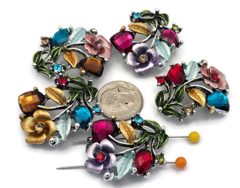 These gemstone‑colored floral 2 hole slider beads feature faceted stones in ruby, sapphire, amethyst, and emerald tones, paired with hand‑painted enamel flowers and silver metal leaves. Perfect as focal beads for bracelets and chokers, the double‑hole design keeps two strands of leather, cord, or beading wire aligned and centered. Pair with seed beads, Czech beads, and crystal accents for vibrant garden‑inspired designs.