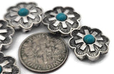 These floral cross 2 hole slider beads are perfect focal beads for bold bracelets and chokers. The turquoise‑style center and detailed silver‑tone petals create a striking Southwestern look. Double holes prevent twisting and keep designs flat. Mix with seed beads, heishi spacers, Czech beads, or gemstone chips for layered Western designs. Durable metal beading components and bracelet beads for boho and ranch‑style jewelry.