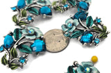 These ornate blue zircon 2‑hole slider beads are perfect focal beads for statement bracelets and chokers. The large faceted cube stones, smaller blue zircon accents, and decorative enamel leaf details create visual interest on leather, cord, or beading wire. Use with seed beads, Miyuki Delicas, Czech beads, or heishi for texture. Versatile bracelet beads and jewelry making components for boho, elegant, and artistic beading designs.