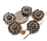 These detailed sunflower slider beads bring cheerful botanical style to bracelets and pendant necklaces. Available in antique silver, copper, and brass, the mixed metal palette pairs with warm and cool tones alike. Built as 2‑hole beads, they stabilize strands like a spacer bar while adding floral charm. Combine these daisy beads with seed beads, rondelles, turquoise‑look accents, pearls, and tribal silver spacers for rustic, farmhouse, and Southwestern designs.