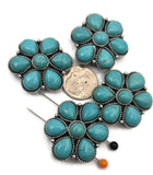 These Western turquoise floral 2 hole slider beads feature multiple turquoise‑style cabochons arranged in a bold flower pattern with silver‑tone metal detailing. Perfect as focal beads for bracelets and chokers, the double‑hole design keeps two strands of leather, cord, or beading wire aligned and centered. Pair with seed beads, Czech beads, heishi, or gemstone chips for striking Southwestern designs. Beautiful bracelet beads and jewelry making components for boho and Western jewelry.