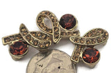 Bring vintage glamour to your projects with these gold 2‑hole slider beads in a ribbon design. Set with a large smoked topaz (cognac‑brown) crystal and rows of sparkling champagne rhinestones, they’re perfect focal beads and connectors for bracelets and necklaces. The double‑hole style keeps strands aligned and professional. Pair with seed beads, gemstone beads, pearls, or crystals for stunning DIY jewelry making supplies.