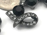 Looking for a bold, dark connector? These gunmetal ribbon 2‑hole slider beads feature a sculpted silhouette, sparkling black diamond pavé accents, and a large jet black crystal for a moody, elegant glow. Ideal as focal beads for multi‑strand bracelets, bead‑woven cuffs, and layered necklaces. Pair with seed beads or gemstone strands to craft sophisticated handmade jewelry. Beautiful metal findings for beading, crafting, and special occasion designs.