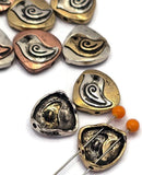 These unique teardrop bird beads showcase a beautiful two‑tone look in silver, gold, and copper with a bold swirl‑wing bird detail. Ideal as focal beads or standout spacers, they’re perfect for bird‑themed bracelets, necklaces, and charm jewelry. Pair with seed beads, turquoise, or earthy gemstones to create layered, mixed‑metal designs. Their substantial teardrop shape adds a high‑end, artisan feel to your beading and crafting supplies.