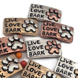 Perfect for animal lovers, these Live Love Bark paw print 2 hole slider beads are ideal metal spacer beads for double strand bracelets and necklaces. Their antique mixed metal finish in silver, copper, and gold adds character to any DIY beading design. Pair them with seed beads, duo beads, or other jewelry making components and findings to create adorable dog themed jewelry and unique bracelet necklace designs.