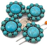 Create bold western jewelry with these turquoise statement 2 hole slider beads in antique silver metal. Featuring a large turquoise style centerpiece surrounded by smaller beads, these metal slide spacer beads are perfect for double strand bracelet and necklace jewelry making. Pair them with seed beads, duo beads, gemstones, or leather cords to design cowgirl bracelets, southwestern jewelry, and rustic handmade DIY beading projects.