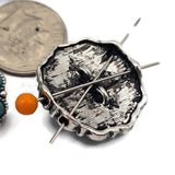 These turquoise floral 2 hole slider beads feature a circular design made of oval turquoise stones surrounding a matching center stone. The antique silver metal frame with bead accents creates a bold western style focal bead. These metal slide spacer beads are perfect for two strand bracelet and necklace jewelry making and pair beautifully with seed beads, duo beads, gemstone beads, and leather cord jewelry designs.