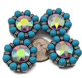 These sparkling 2 hole slider beads feature a large aurora borealis crystal center surrounded by round turquoise beads in an antique silver frame. The reflective crystal adds rainbow sparkle while the turquoise beads create a bold contrast. These metal slide spacer beads are perfect for two strand bracelet and necklace jewelry making and pair beautifully with seed beads, duo beads, gemstone beads, or leather cord designs.