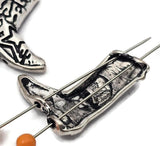 Bring western charm to your handmade jewelry with these Yee Haw cowboy boot two hole slider beads. Featuring intricate western boot details and bold lettering, these beads make a fun focal piece for double-strand bracelets and necklaces. The two holes on the back allow for creative jewelry designs using leather, cord, or wire. Perfect for western jewelry makers, rodeo themes, and country inspired accessories.