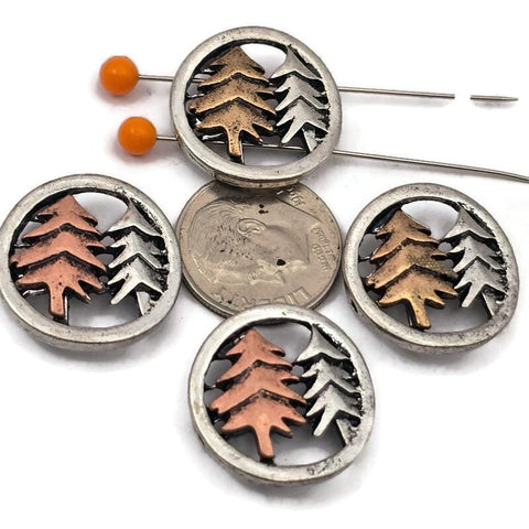 Add a woodland touch to your jewelry designs with these two hole tree slider beads featuring a light pewter silver frame and detailed pine trees in mixed metal tones. Perfect for double strand bracelets and necklaces using leather cord, wire, or thread. These beads pair beautifully with seed beads, duo beads, Czech glass beads, gemstone beads, and spacer beads to create rustic forest jewelry, nature themed accessories, and handmade artisan designs.