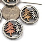 These beautiful tree two hole slider beads feature a round woodland design with raised pine trees set inside a light pewter silver frame. Ideal for double strand bracelet designs, they work wonderfully with seed beads, superduo beads, Czech beads, crystal beads, and natural stone beads. Perfect for jewelry makers creating forest inspired jewelry, rustic nature bracelets, woodland accessories, and handmade outdoor themed designs.