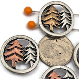 Create nature inspired jewelry with these forest tree slider beads. The round frame in light pewter silver surrounds detailed pine trees in mixed metal tones, creating a beautiful woodland focal bead. Designed with two holes on the back for double strand jewelry designs, they pair perfectly with seed beads, duo beads, glass beads, gemstone beads, and spacer beads for rustic bracelets, necklaces, and forest themed jewelry.