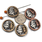 Add rustic woodland charm to your jewelry designs with these two hole pine tree slider beads featuring warm bronze and copper tone frames with layered tree silhouettes. These nature inspired beads are perfect for double strand bracelets and necklaces using leather cord, beading wire, or thread. They pair beautifully with seed beads, superduo beads, Czech glass beads, gemstone beads, and metal spacers for forest jewelry, nature themed accessories, and handmade rustic designs.