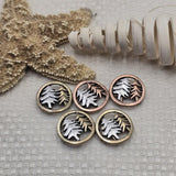 Bring nature inspired beauty to your jewelry designs with these round pine tree two hole slider beads. The bronze and copper tone frames surround layered tree silhouettes that create a beautiful woodland focal bead. Perfect for double strand bracelet designs and layered necklaces, they combine beautifully with seed beads, duo beads, crystal beads, Czech beads, and natural stone beads for rustic jewelry, forest jewelry, and outdoor themed accessories.