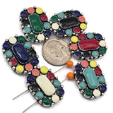 These bright western enamel slider beads bring colorful southwestern style to handmade jewelry. The oval design features a raised center with surrounding enamel accents in vibrant colors that create a bold focal bead. Designed with two holes on the back, they are perfect for double strand bracelets and layered necklaces. A great choice for cowgirl jewelry, western fashion accessories, boho jewelry, and colorful handmade bracelet designs.