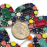 These beautiful southwestern enamel slider beads feature a bold oval design filled with vibrant enamel colors surrounding a raised centerpiece. The two hole design makes them perfect for double strand bracelet and necklace designs. Jewelry makers love using these beads for cowgirl jewelry, western themed accessories, boho jewelry designs, and colorful handmade bracelets that stand out.