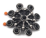 Make a bold statement with these western concho style floral slider beads. Featuring a dramatic cluster design with black enamel accents and antique silver tone metal, these beads create a stunning focal piece for handmade jewelry. The two hole construction makes them perfect for double strand bracelets and necklaces using leather cord, seed beads, or gemstone beads. Ideal for cowgirl jewelry, western accessories, and statement jewelry designs.