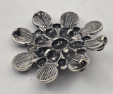 These striking black enamel western slider beads feature a detailed floral cluster design surrounded by round concho style accents. The bold shape makes them perfect focal beads for bracelets and necklaces. Designed with two holes on the back, they are ideal for double strand jewelry designs. A great choice for western jewelry, cowgirl accessories, southwestern designs, and bold handmade statement pieces.