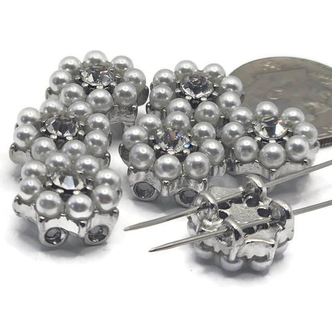 Elegant platinum silver 2 hole slider beads featuring shimmering clear rhinestones surrounded by soft faux pearls in a floral cluster design. These metal spacer beads are perfect for bracelet and necklace jewelry making, adding a luxurious bridal or vintage touch. Pair with seed beads, duo beads, or crystal beads to create stunning designs for weddings, special occasions, or everyday elegance with high-end sparkle and texture.