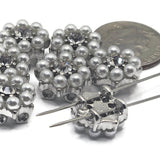 These silver pearl and rhinestone 2 hole slider beads bring timeless elegance to your jewelry designs. The floral-inspired cluster combines luminous faux pearls with a sparkling crystal center, ideal for bracelets and necklaces. Perfect for jewelry making projects using seed beads, duo beads, or gemstone beads. These spacers add dimension, shine, and a sophisticated bridal aesthetic to handcrafted designs and boutique-quality creations.