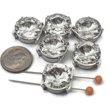 Make your jewelry stand out with these large crystal rhinestone slider beads in a silver tone setting. Designed with two holes for double strand designs, they are perfect for bracelets and necklaces. Pair with seed beads, duo beads, or glass beads to create elegant, high-shine jewelry pieces with a bold focal point and luxurious finish.