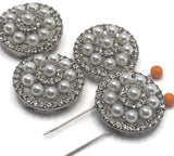 Add a touch of glamour to your jewelry designs with these pearl and rhinestone 2 hole slider beads. The circular layered design creates depth and shine, making them perfect for statement bracelets and necklaces. Pair with seed beads, duo beads, or spacer beads to create beautiful jewelry pieces with a vintage, bridal, or designer-inspired style.