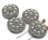 These silver tone 2 hole slider beads feature a beautiful arrangement of faux pearls and sparkling rhinestones in a circular pattern. Ideal for bracelet and necklace jewelry making, they offer a bold yet elegant focal element. Pair with seed beads, duo beads, or crystal beads to create high-end, polished designs perfect for weddings, gifts, or boutique jewelry collections.