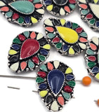 Create bold statement jewelry with these colorful mosaic teardrop 2 hole slider beads. Featuring vibrant enamel colors set in antique silver metal, these metal slide spacer beads are perfect for double strand bracelet and necklace jewelry making. Pair them with seed beads, duo beads, gemstones, or leather cords to design boho bracelets, festival jewelry, southwestern inspired pieces, and handmade DIY beading designs.
