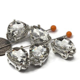 These double hole teardrop slider beads feature brilliant clear rhinestone crystal in a silver prong setting. A go-to focal bead for bridal jewelry makers, beaders, and crafters. Use in stringing, bead weaving, and wire wrapping. Pairs well with CzechMates, Duo, and SuperDuo designs.