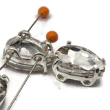 These clear rhinestone double hole slider beads are a stunning choice for wedding jewelry, headpieces, and formal necklaces. Silver prong set cut glass crystal teardrop design. Great for stringing, bead weaving, and crafting. Compatible with CzechMates,  and Duo.