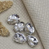 These 2 hole rhinestone slider beads are a favorite for wedding jewelry, headpieces, and formal necklaces. Brilliant cut glass crystal teardrop in silver prong setting. Compatible with CzechMates, Duo, and SuperDuo beading projects. Perfect for beaders, crafters, and jewelry designers.