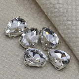 Clear cut glass teardrop focal slider beads with silver prong setting for jewelry making and crafting. These 2 hole spacer beads are ideal for wedding headpieces, custom veils, necklaces, and bracelets. Compatible with Duo, CzechMates, and other double hole beading systems.