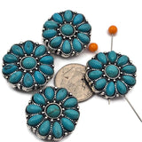 These western style 2 hole slider beads feature turquoise colored oval stones arranged in a circular floral pattern with a matching turquoise center. Set in an antique silver metal frame with detailed beaded accents, these metal slide spacer beads are perfect for two strand bracelet and necklace jewelry making. They pair beautifully with seed beads, duo beads, gemstone beads, and leather cords, making them ideal for western jewelry and boho DIY beading designs.