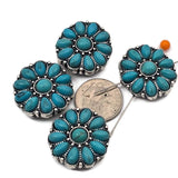 Create beautiful handmade jewelry with these turquoise western 2 hole slider beads featuring a floral cluster of oval turquoise stones surrounding a center turquoise cabochon. The antique silver setting with dotted detailing adds texture and contrast. Designed as metal slide spacer beads for double strand bracelet and necklace jewelry making, they pair perfectly with seed beads, duo beads, gemstones, or leather cords for boho and western jewelry designs.