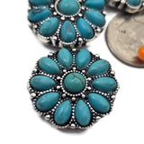 These 2 hole slider beads feature turquoise oval stones arranged in a floral cluster with a center turquoise cabochon set in antique silver metal. The detailed dotted accents add depth and texture. These metal slide spacer beads are ideal for two strand bracelet and necklace jewelry making and pair beautifully with seed beads, duo beads, gemstone beads, and leather cords for western and boho jewelry designs.