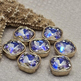 Clear AB rhinestone square unique findings with full gold bezel setting and stunning aurora borealis shimmer. These 2 hole spacer beads work beautifully in multi-strand bracelets, layered necklaces, and bead weaving projects. Compatible with CzechMates, tile beads, and other double hole bead designs. Perfect for beaders and jewelry crafters.