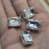 Clear rhinestone emerald cut rectangle 2 hole slider beads in open back platinum silver prong setting, 19mm x 13mm, 7.5mm between holes. Rare hard to find focal beads perfect for statement necklaces, bridal jewelry, and bead weaving anchor points. Pair with seed beads, turquoise, hematite, and Czech glass as supporting beads. Unique architectural rhinestone findings for beaders and jewelry designers seeking something truly special.