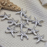 These stunning antique silver starfish double hole focal beads are rare hard to find metal findings for coastal jewelry makers and serious beaders. Perfect 2 hole slider beads for beach inspired bracelets, nautical necklaces, and bead weaving projects. Pair with turquoise chips, sea glass colored beads, freshwater pearls, coral, and seed beads around them.