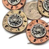 Bring the beauty of the ocean to your jewelry designs with these sand dollar slider beads. The detailed silver sand dollar center is framed by a textured antique style border that gives these beads a unique coastal look. With two holes on the back, they are perfect for double strand bracelets and creative necklace designs. Great for beach jewelry, nautical accessories, and ocean themed handmade jewelry.